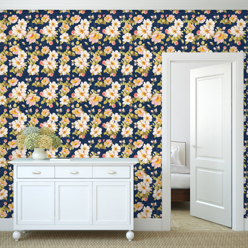 Pink and blue Victorian floral fabric peel and stick wallpaper in a hallway with a piece of furniture