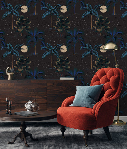 Dark tropical peel and stick wallpaper with side table and orange chair